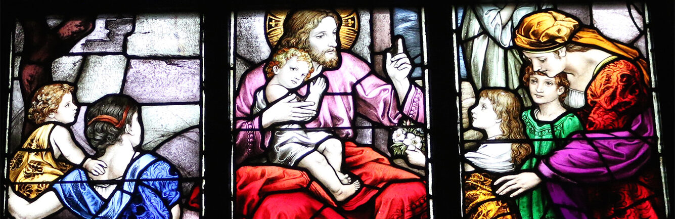 Stained glass window with Jesus and children